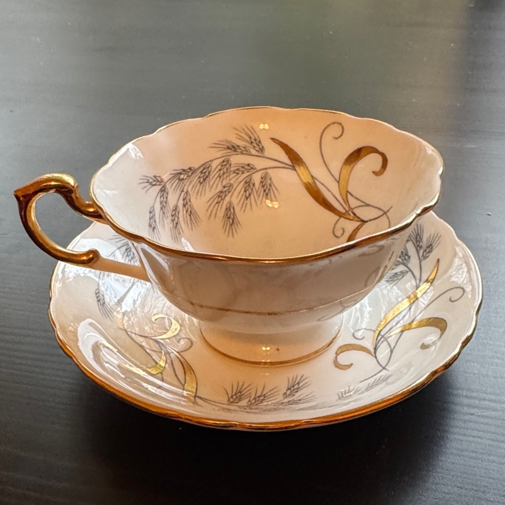 PARAGON Gold and Cream Teacup and Saucer Set